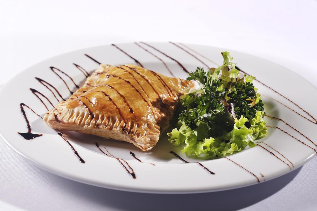 Sheraton Reserva Do Paiva カボ・デ・サント・アゴスチーニョ エクステリア 写真 A plate of empanadas